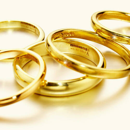 Selection of handcrafted Welsh gold wedding bands displaying traditional profiles and UK hallmarks