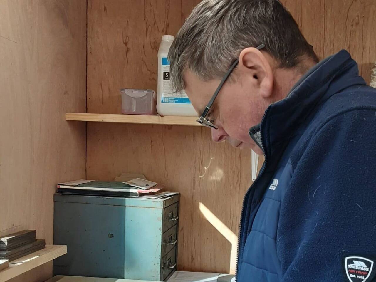 Image of Richard, Goldsmith at Welsh Gold, working on a ring in his workshop.