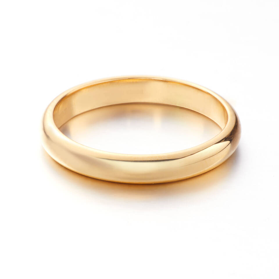 A high-polished gold wedding ring featuring a D-section profile, characterised by a curved exterior and a flat interior for a traditional fit.