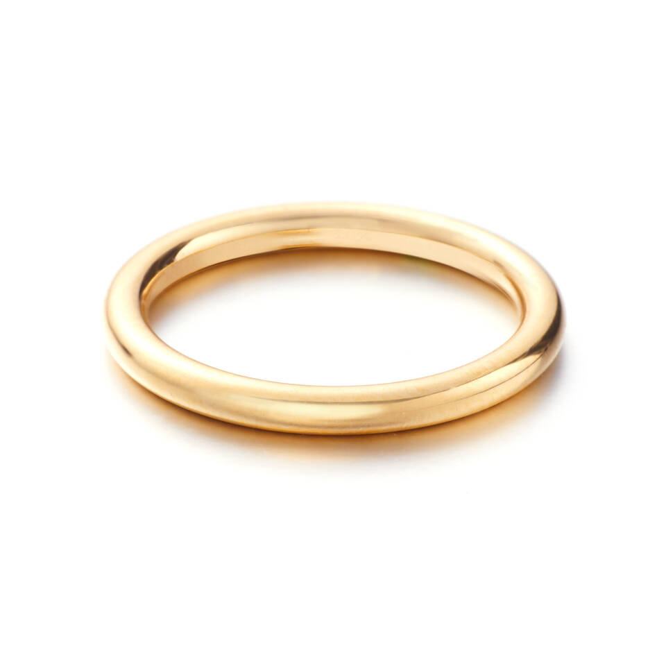 Detailed product view showcasing a sleek, polished gold band made from 100% authentic Welsh gold, emphasising its elegant simplicity and the superior craftsmanship of the forge.
