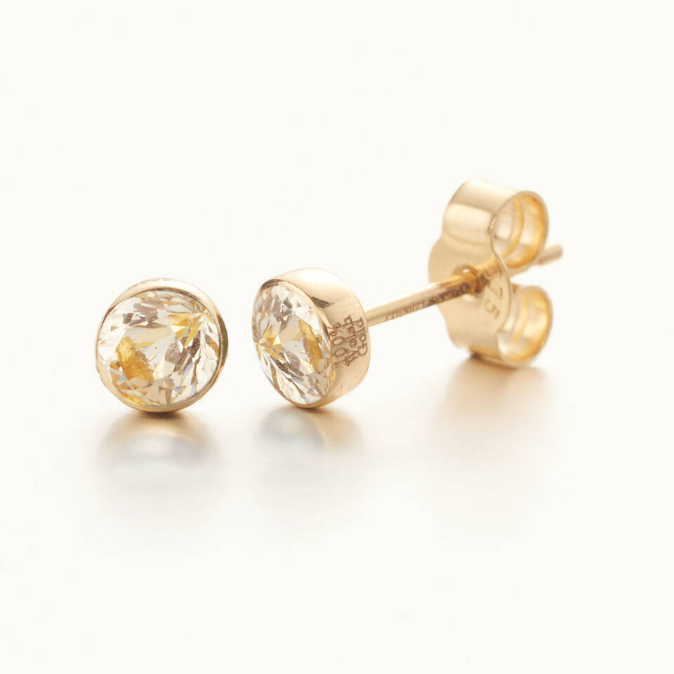 Pair of 100% Welsh gold stud earrings with 4mm round diamond cabochons in a secure bezel setting.