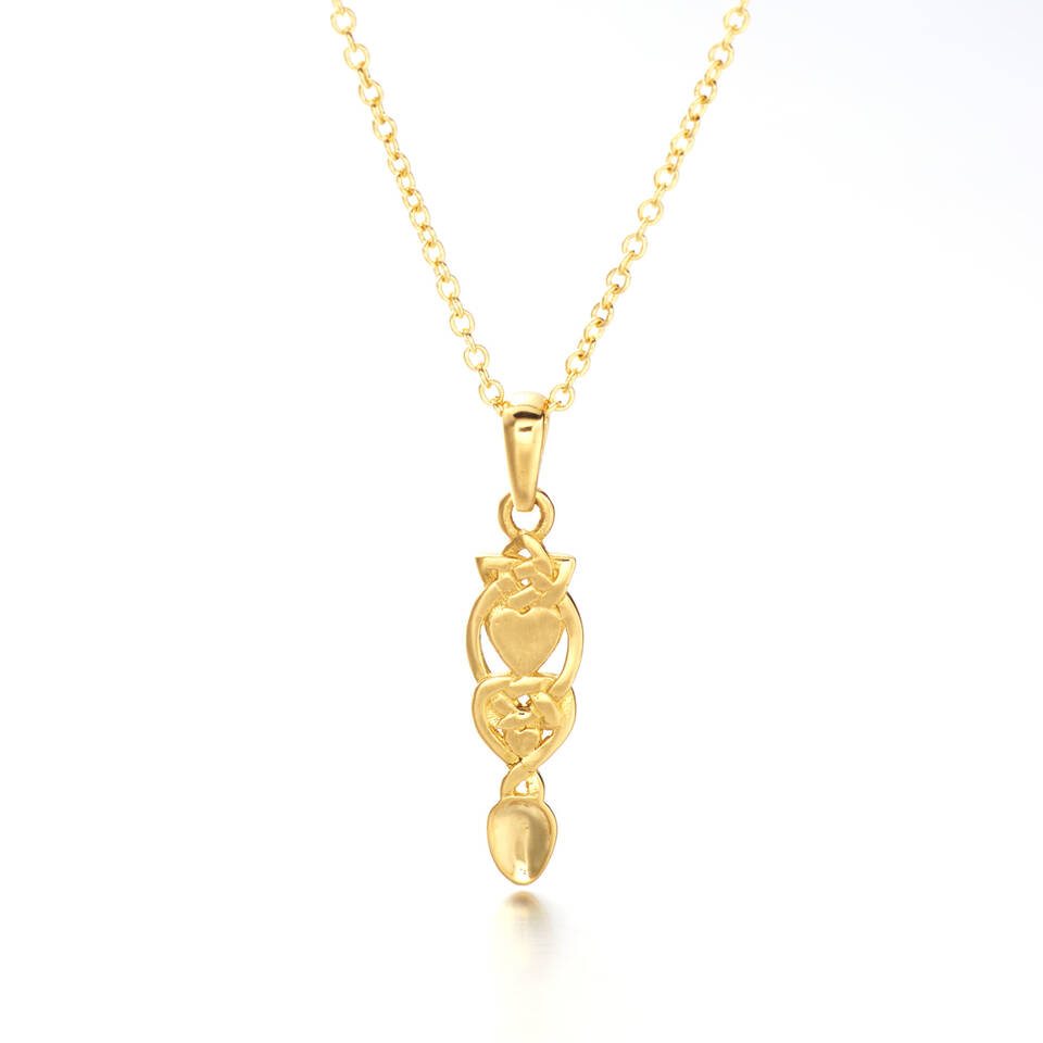 An 100% Welsh gold mini Love Spoon pendant featuring delicate heart motifs on an 18-inch trace chain against a plain light background.
