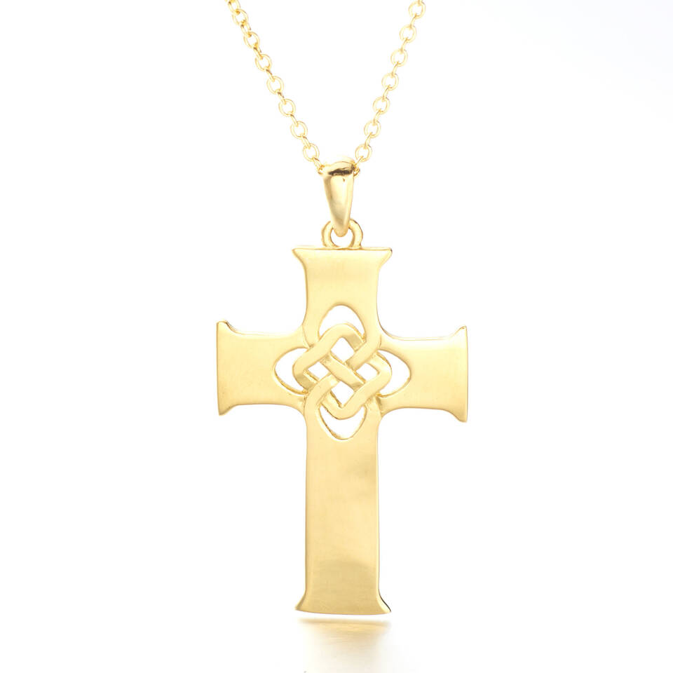 A 100% Welsh gold Celtic cross pendant featuring a central woven knot motif on an 18-inch gold curb chain against a plain white background.