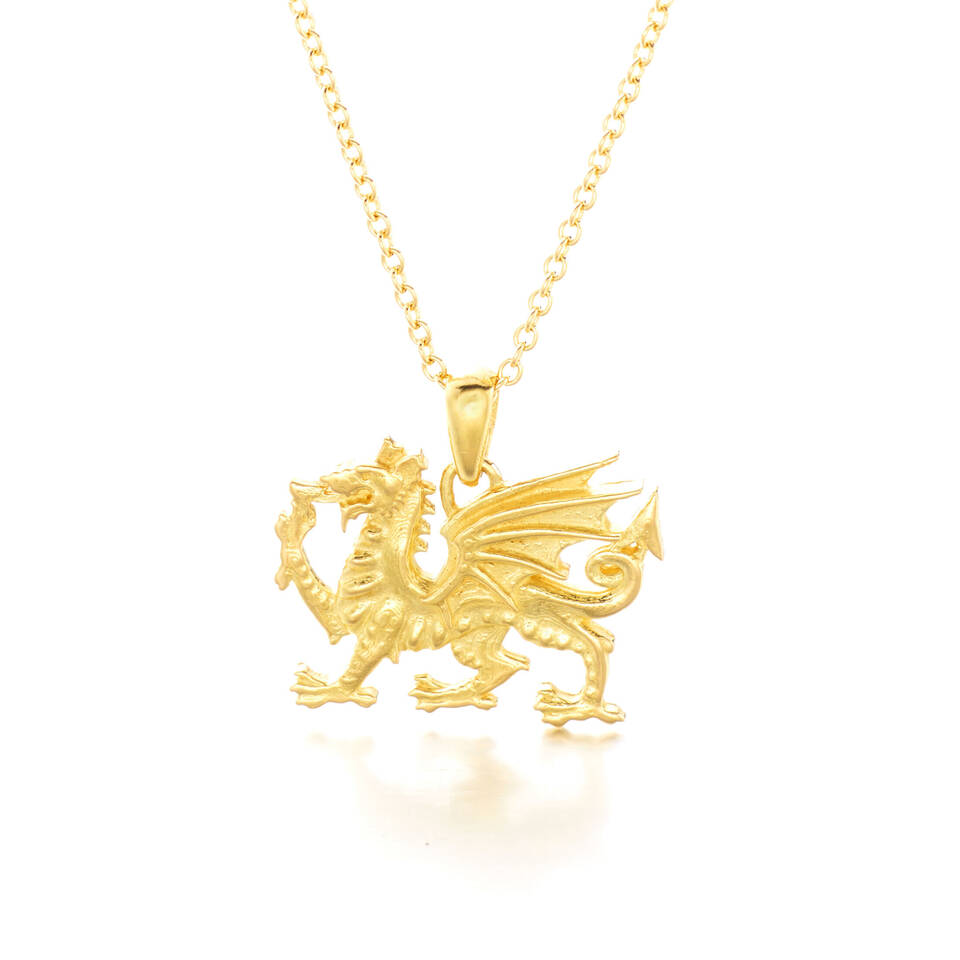Close up view of the handcrafted 20% Welsh gold dragon pendant detailing Y Ddraig Goch