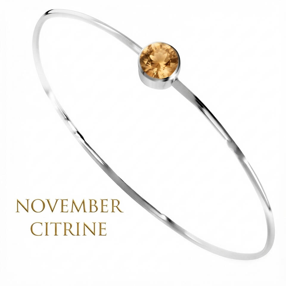 Handmade 5% Welsh silver wire bangle set with a 5mm natural Topaz birthstone for November
