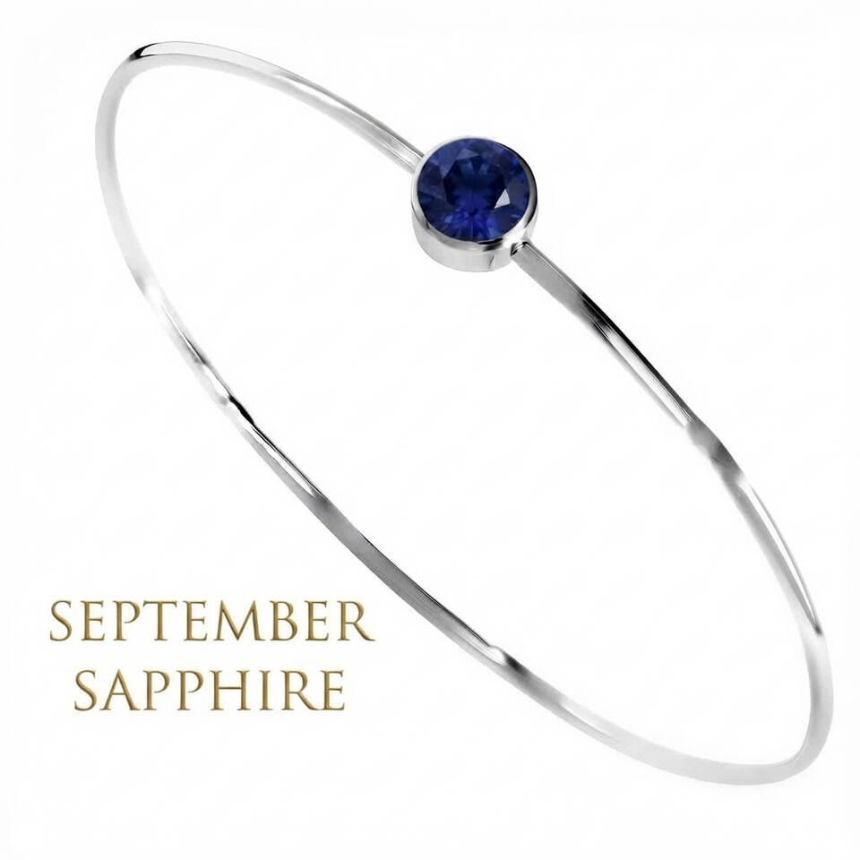 Handmade 5% Welsh silver wire bangle set with a 5mm natural Sapphire birthstone for September