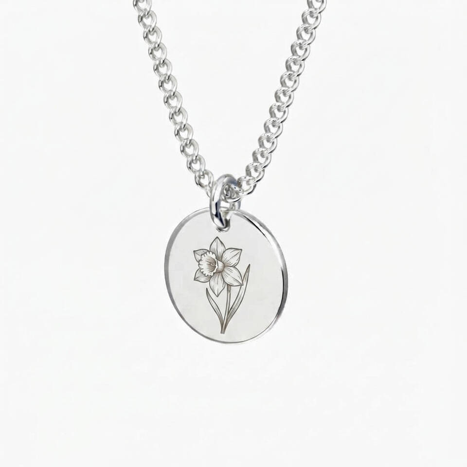 Handmade 5% Welsh silver disc pendant engraved with a daffodil motif on a sterling silver chain