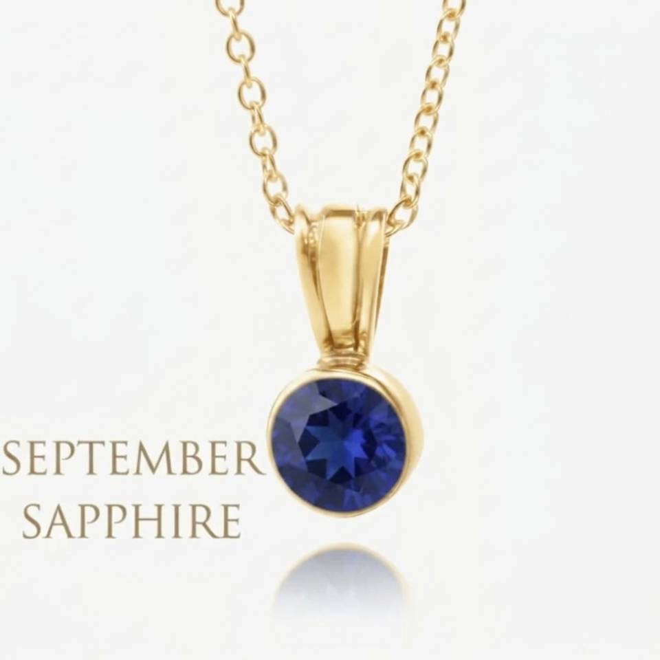 18ct Eryri Welsh gold bezel pendant featuring a natural September sapphire gemstone