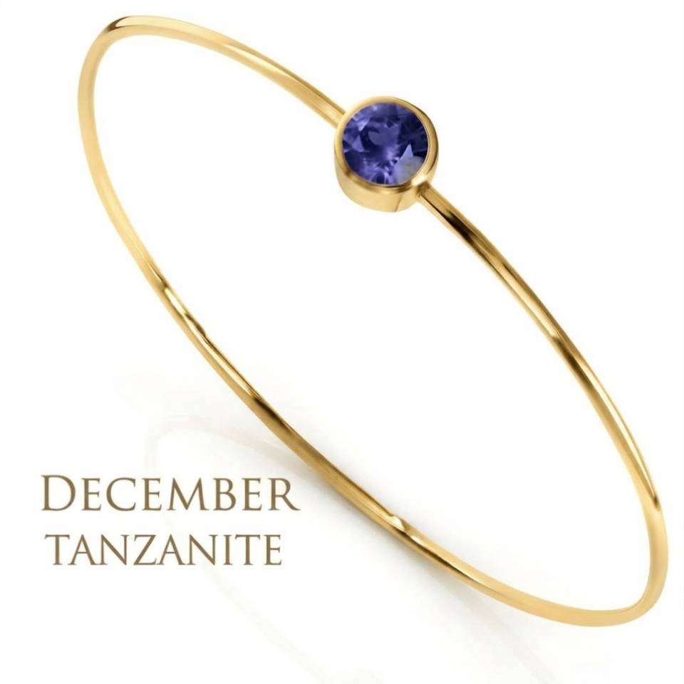 18ct Eryri Welsh gold 1.2mm wire bangle set with a natural December tanzanite gemstone