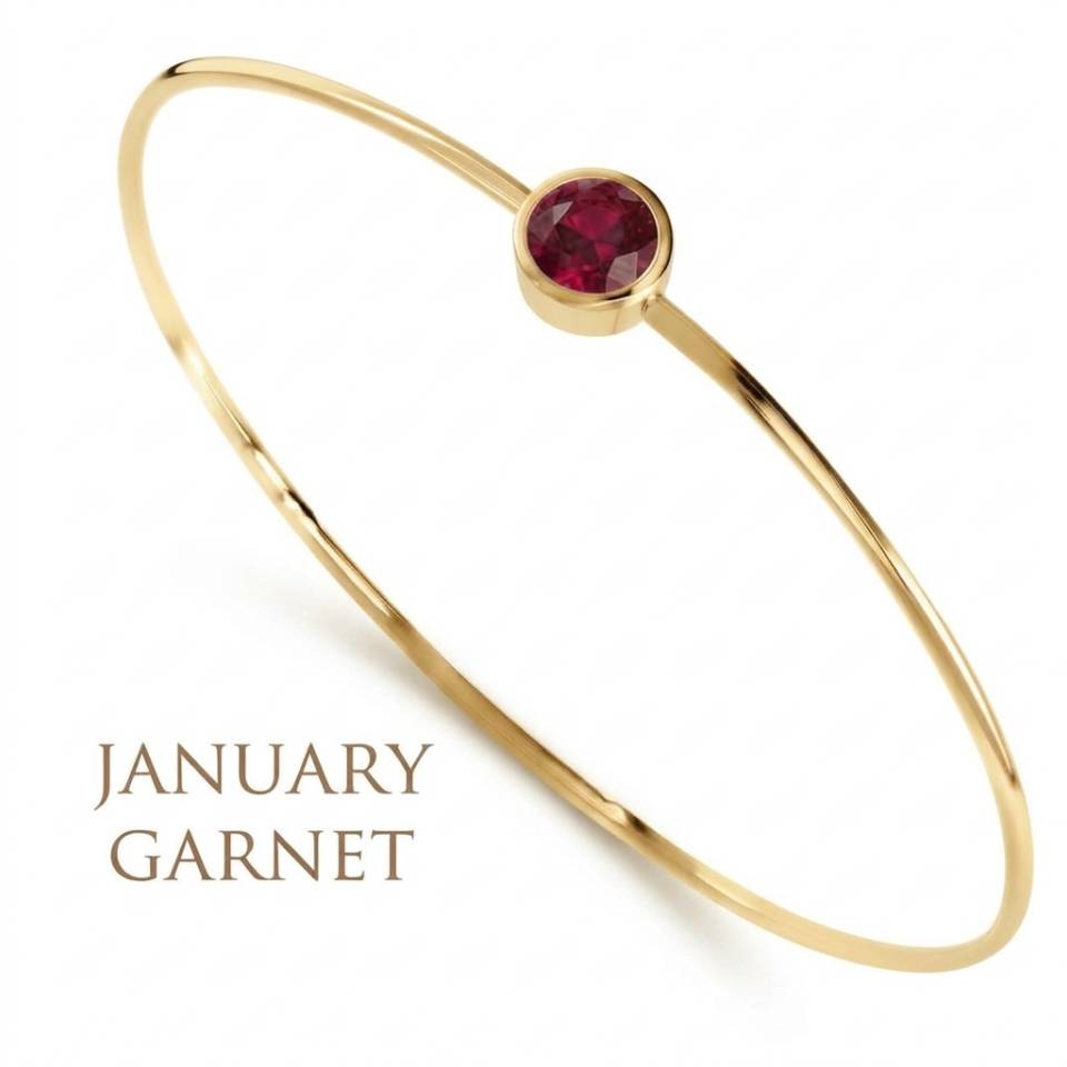 18ct Eryri Welsh gold 1.2mm wire bangle set with a natural January garnet gemstone.