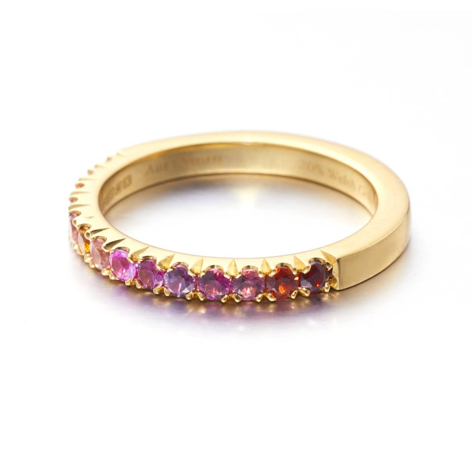 18ct Welsh gold castile-set rainbow gemstone eternity ring featuring sapphires, garnets, citrines, and amethysts