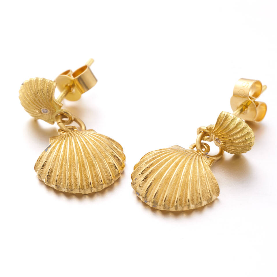 Side profile view of gold shell drop earrings showing the post backings and articulated drop mechanism
