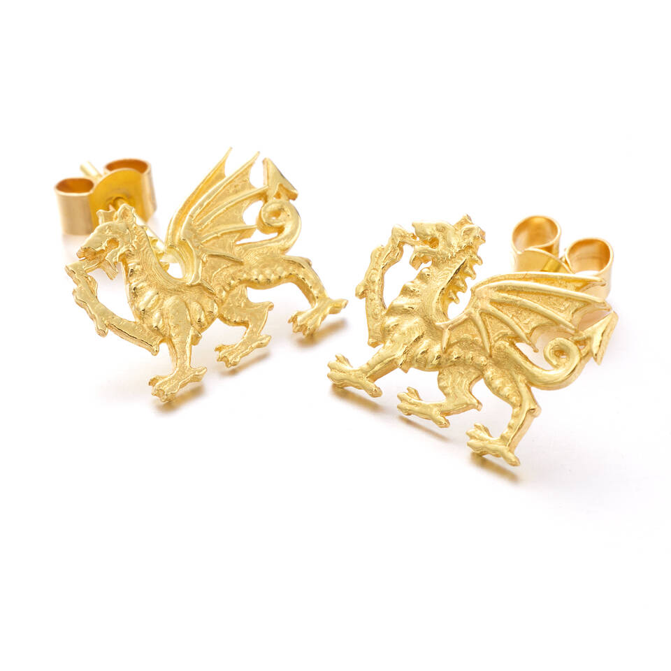 Welsh gold and Fairmined gold Y Ddraig Goch Red Dragon stud earrings on a white background showing fine heraldic detail.